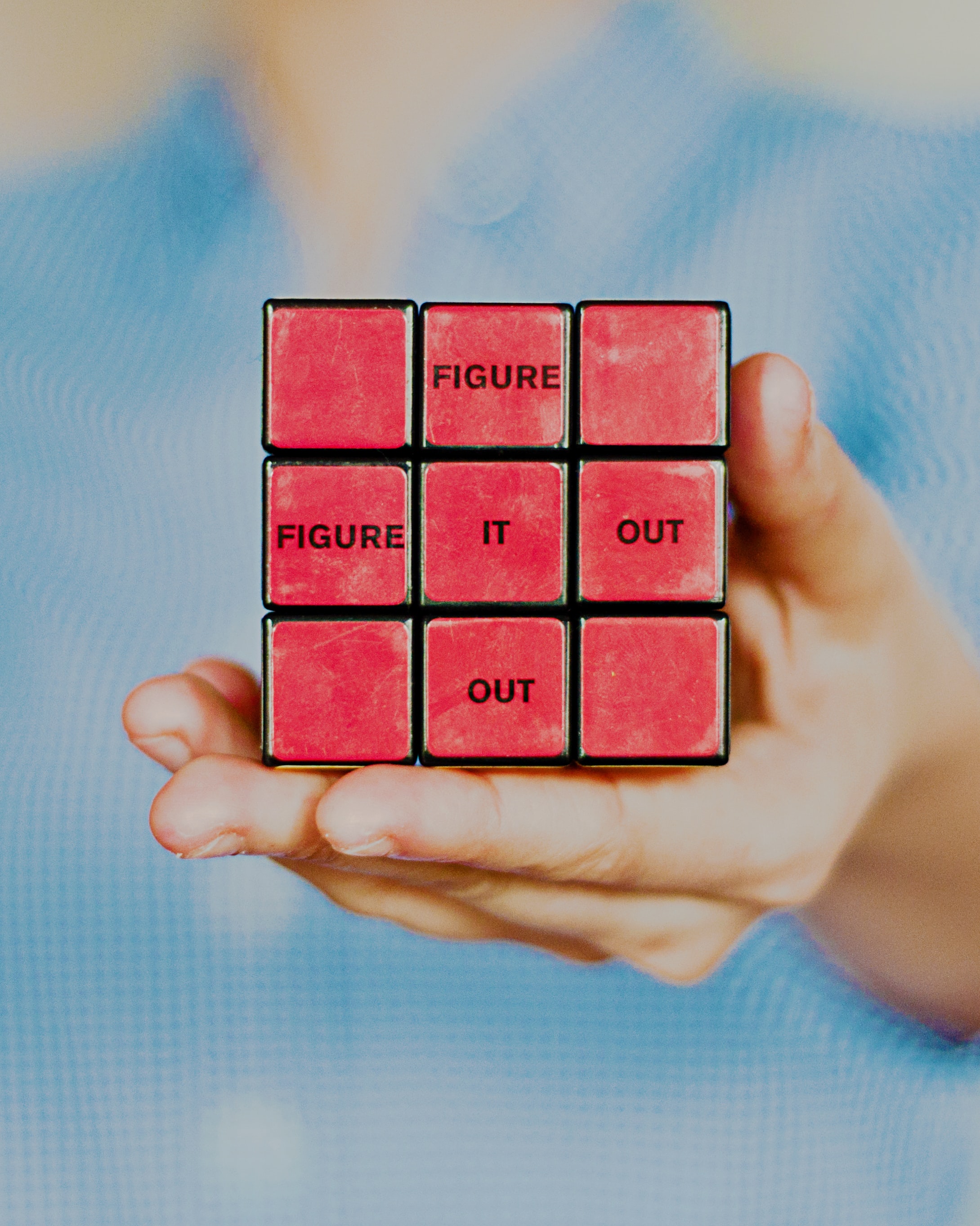 image of rubik's cube with words "figure it out" on the tiles